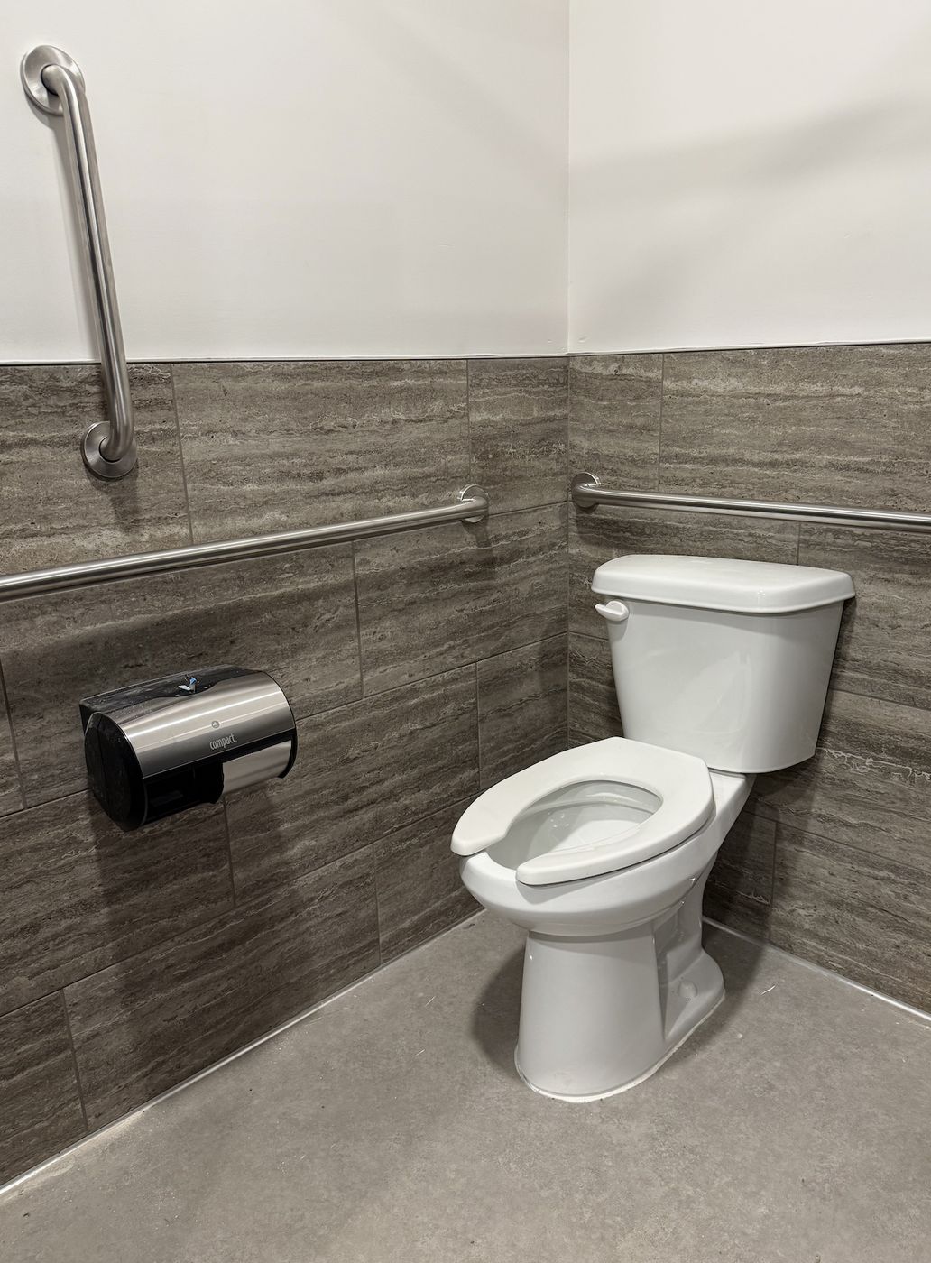 Accessible restroom stall with grab bars