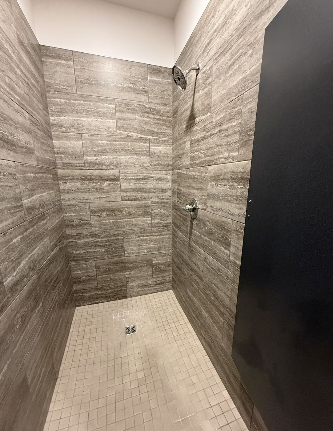 Tiled private shower in the bath house