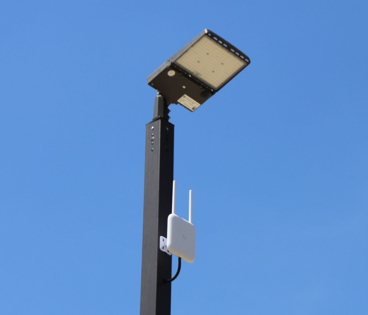 Wifi access point on a light pole in the park